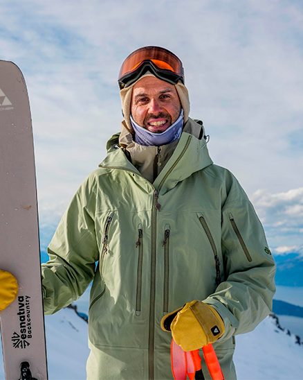 Niki Salencon on a mountain summit with his skis